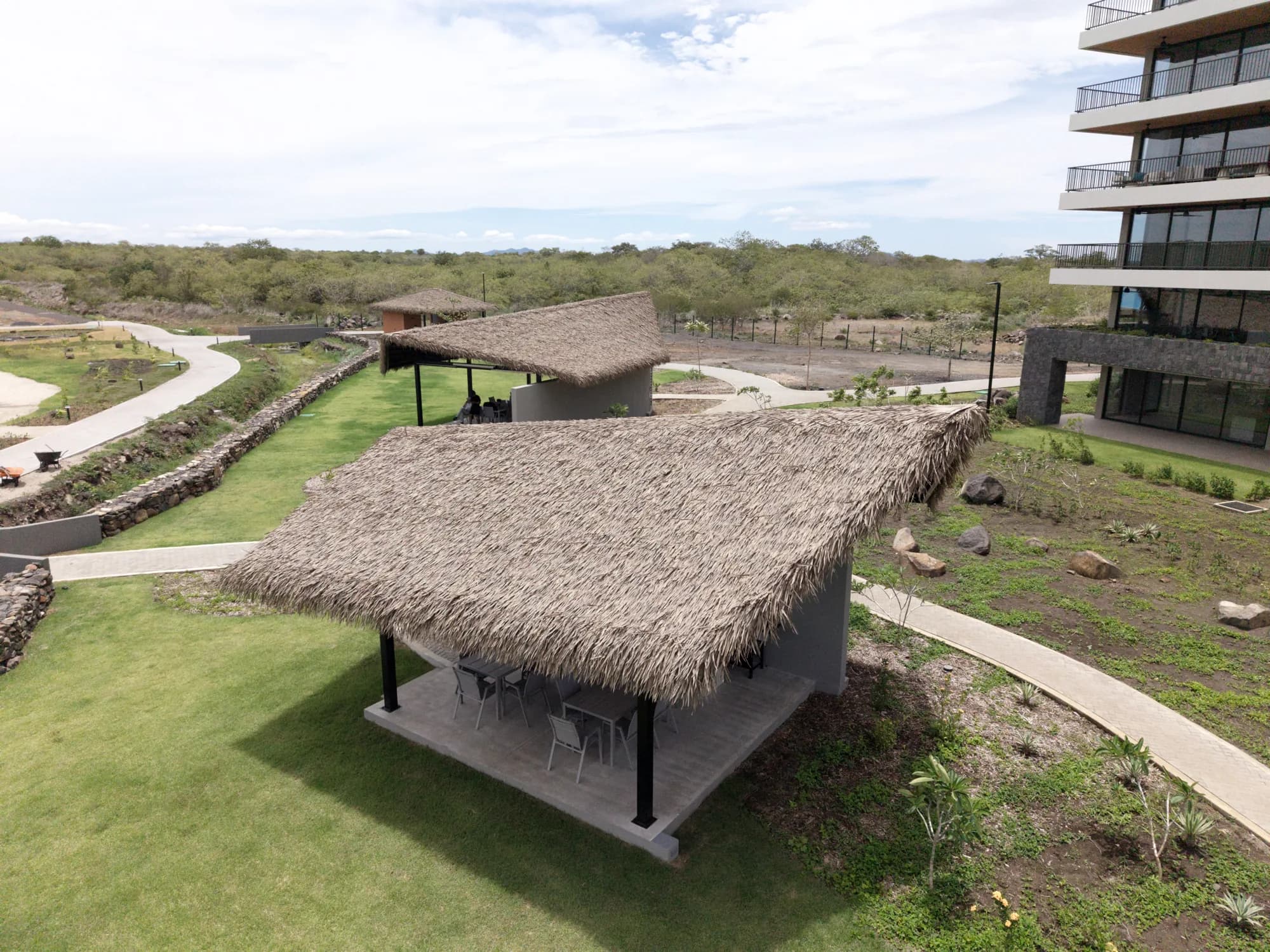Two synthetic thatch amenity palapas seen from above, Guanacaste